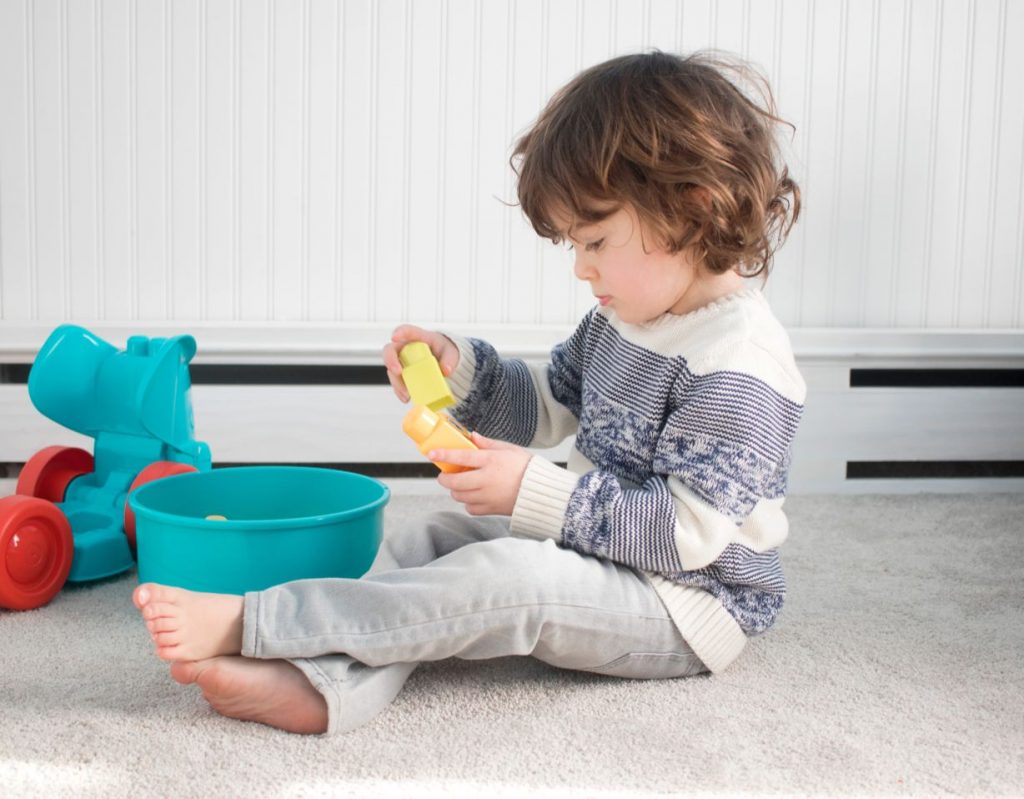 kid playing on soft carpet