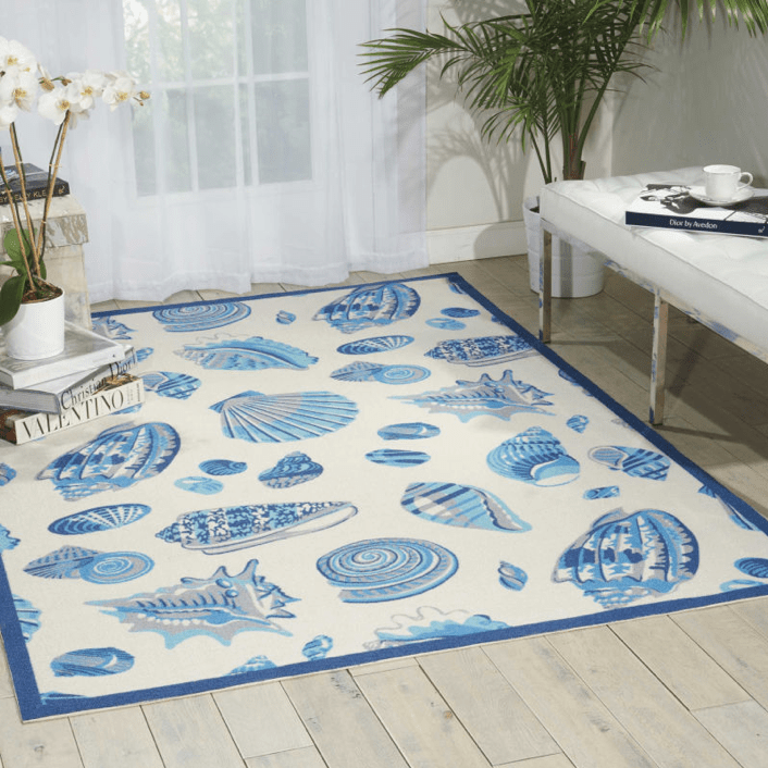 seashell themed area rug in blue