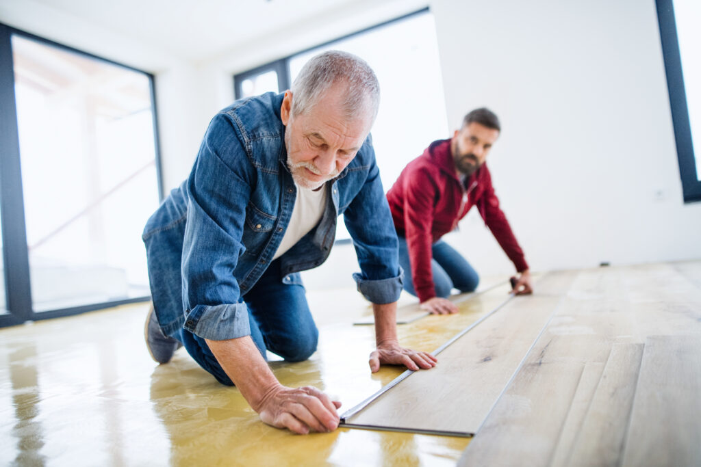 laminate luxury vinyl install with father and son bonding | Dolphin Carpet & Tile