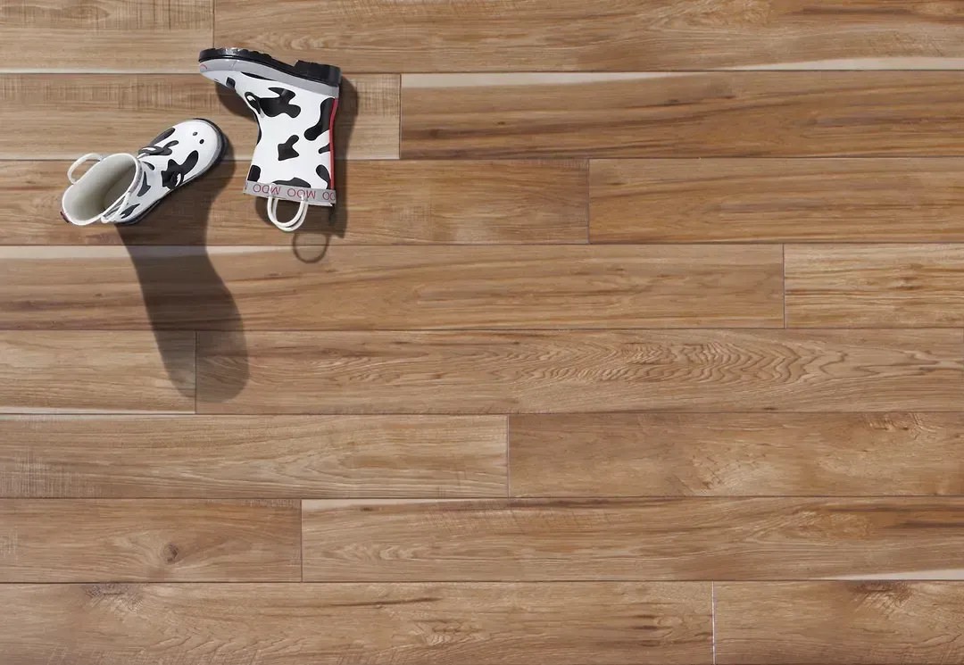 Hickory-Laminate-Scratch-Protection.webp Hickory Look Laminate with boots on floor | Dolphin Carpet