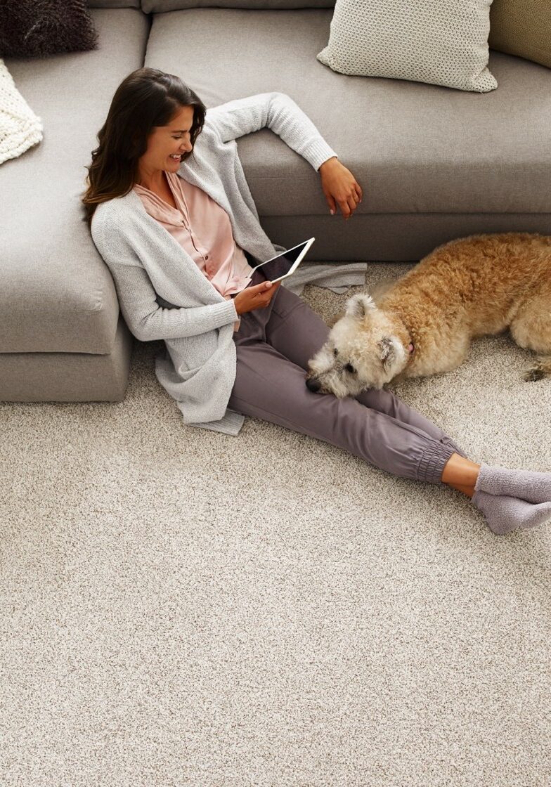 woman and dog on carpet | Dolphin Carpet & Tile