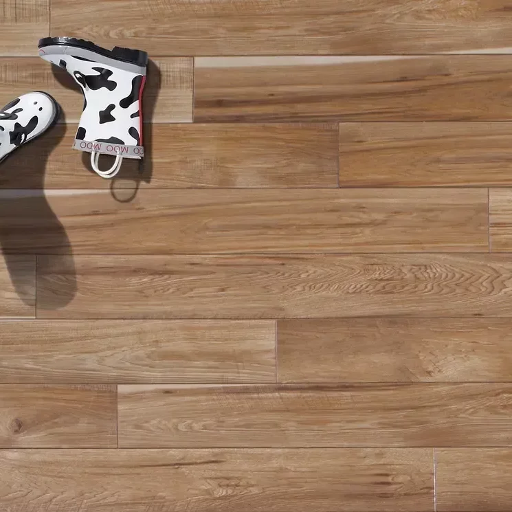 Hickory Look Laminate with boots on floor | Dolphin Carpet