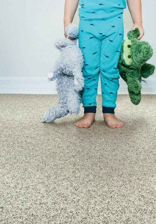 Kid playing with toys on grey Air.O Carpet